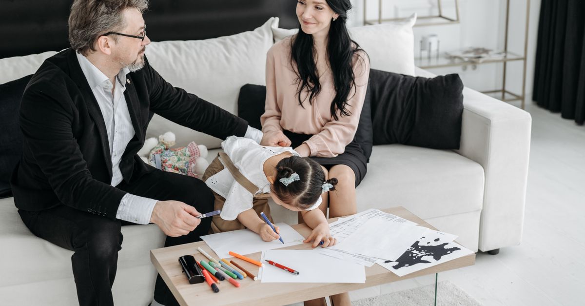 A family enjoying a creative drawing session together at home.